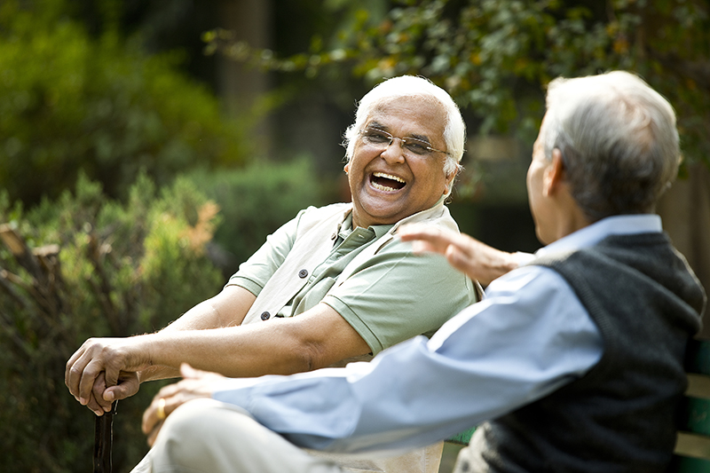 Senior men laughing together outside
